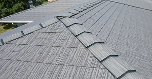 a gray-toned steel shingle roof on a residential home